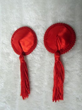 Cache-tétons nippies simples rouges à pompons