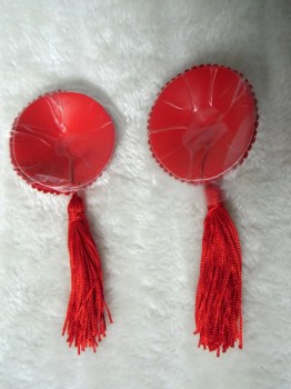 Cache-tétons nippies simples rouges à pompons